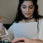 Home Recording Studio - A Woman in White Coat Sitting at the Table