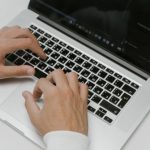 Hardware And Software - Hands on a Laptop Keyboard