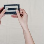 Audio Format - Person Holding Black and Gray Cassette Tape