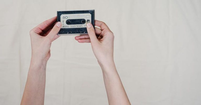 Audio Format - Person Holding Black and Gray Cassette Tape