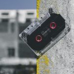 Multi-Track Recording - Clear and Black Cassette Tape on Gray Surface