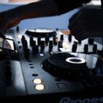 DJing - Person Playing Black and White Dj Controller