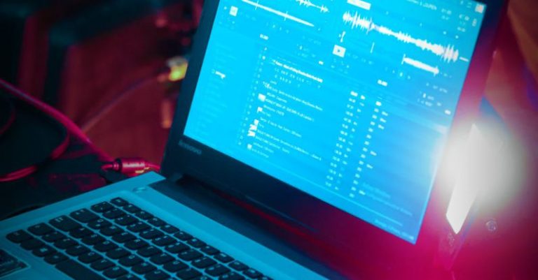 DJ Software - Laptop with DJ Mixing Software in a Night Club