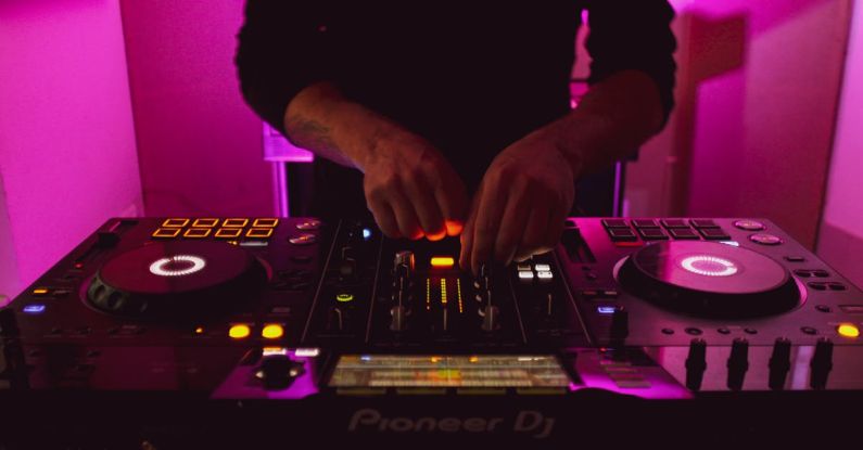 DJing - Person in Black Long Sleeve Shirt Playing Dj Controller