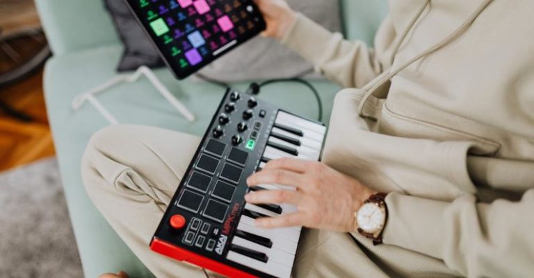MIDI Controllers - Hands of a Man Using a MIDI Controller