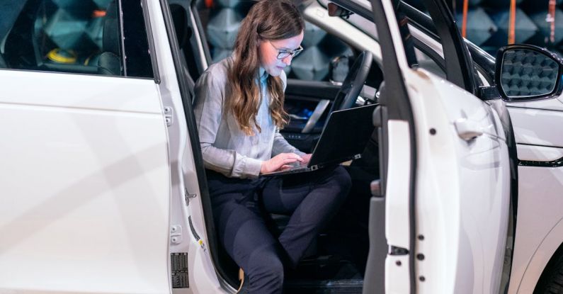 Sound Engineer - Female Engineer Sitting on a Car