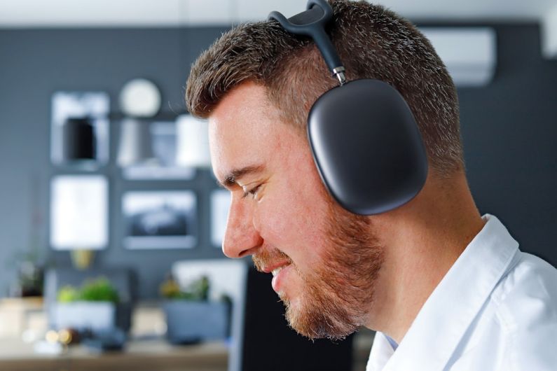 Dolby Atmos - a man with a beard wearing a headset
