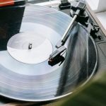 High-Resolution Audio - Vintage record player with disc placed on windowsill