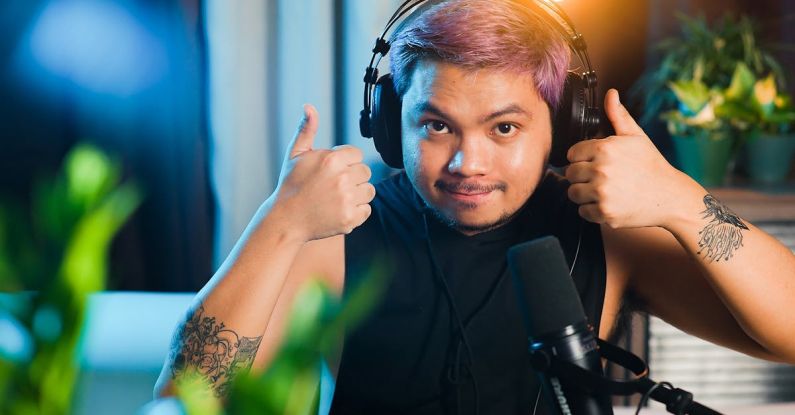 Studio Headphones - A man with purple hair giving the thumbs up