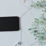 Bluetooth Headphones - Smart Phone and Bluetooth Headphones and Glasses on White Background