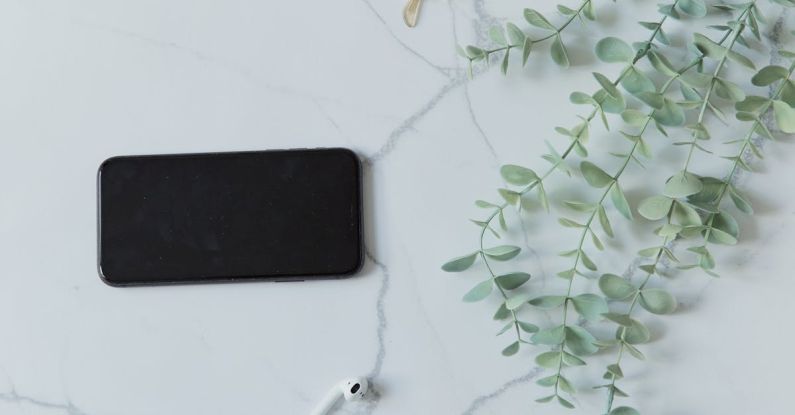 Bluetooth Headphones - Smart Phone and Bluetooth Headphones and Glasses on White Background