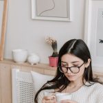 Streaming Royalties - Woman Having Coffee And Using Laptop In Bed