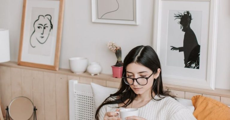 Streaming Royalties - Woman Having Coffee And Using Laptop In Bed