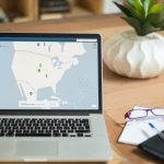 Streaming - Macbook Pro on Brown Wooden Table