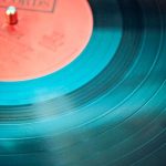 Audio - Blue Vinyl Record Playing on Turntable