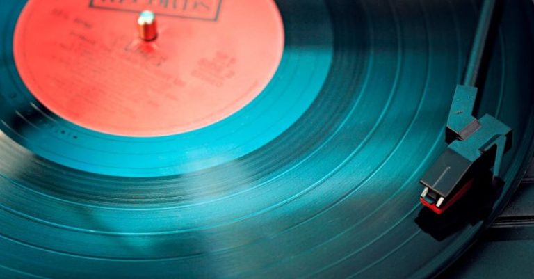 Audio - Blue Vinyl Record Playing on Turntable