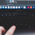 Audio Software - Crop man using laptop while making music