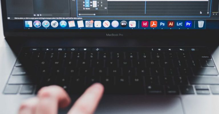 Audio Software - Crop man using laptop while making music