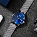 Analog Gear - Analog Wrist Watch on A Gray Surface