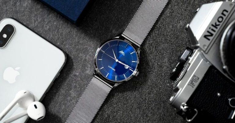 Analog Gear - Analog Wrist Watch on A Gray Surface