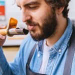 Sampling - A Man Smelling a Coffee Roasting Sampler