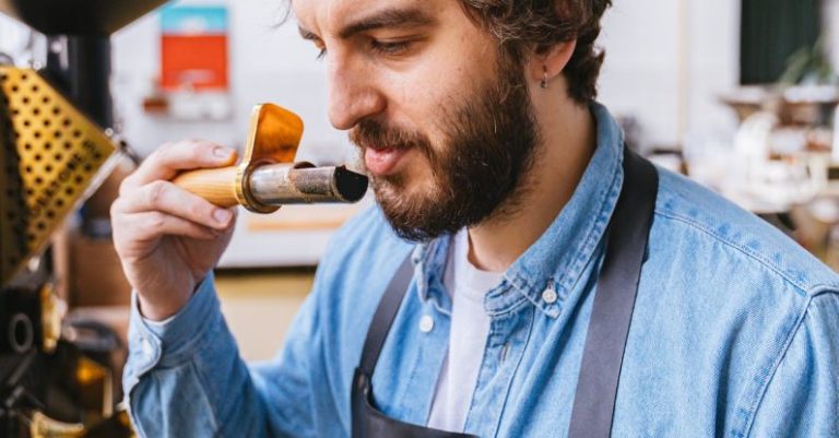 Sampling - A Man Smelling a Coffee Roasting Sampler