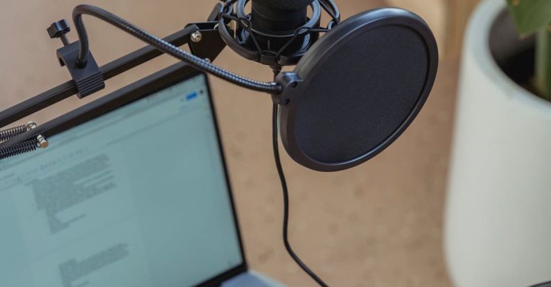 Music Production Workflow - Microphone on tripod attached to laptop in studio