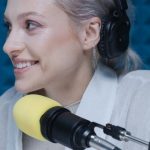 Podcasting - Woman in White Long Sleeve Shirt Wearing Black Headphones