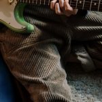 Home Studio - Person Playing Red and White Stratocaster Electric Guitar